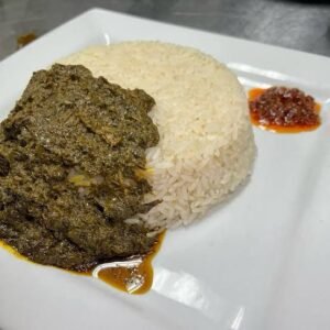 White rice served with cassava leaves